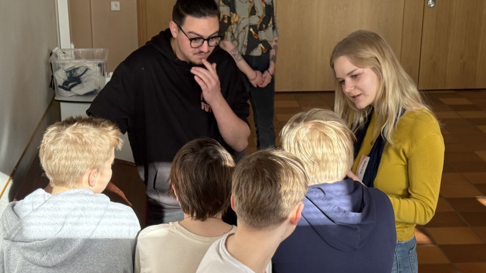 two people talking with children